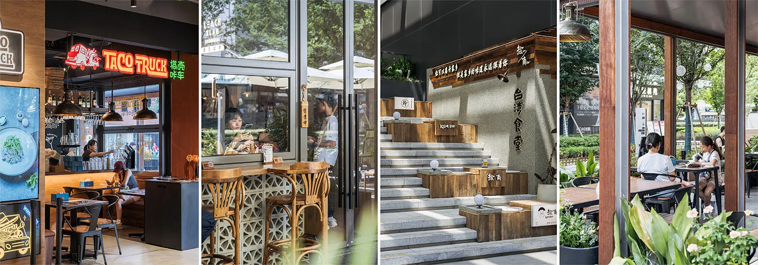 A lively restaurant interior with a wooden staircase, dining tables, chairs, and potted plants, with people sitting and standing around