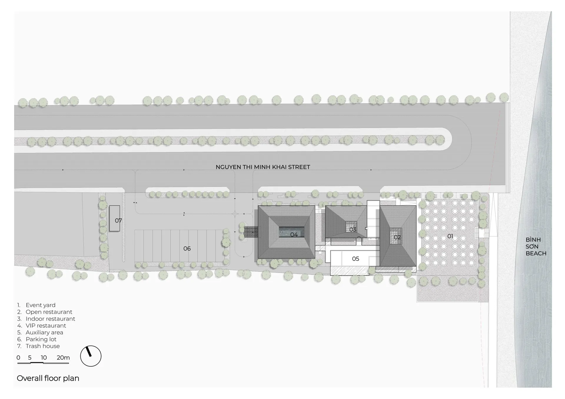 現代建築擁有白色外觀、車庫區域，以及燈光明亮的行人友善街道