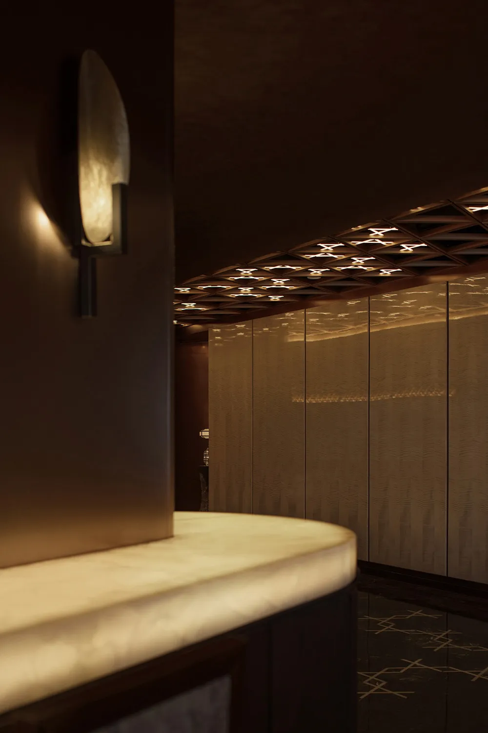 Darkly lit kitchen or dining area with a central countertop, sink, and two side lights