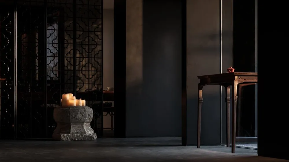 A dimly lit dining room with a modern aesthetic, featuring a wooden table and stone elements, surrounded by chairs and candles