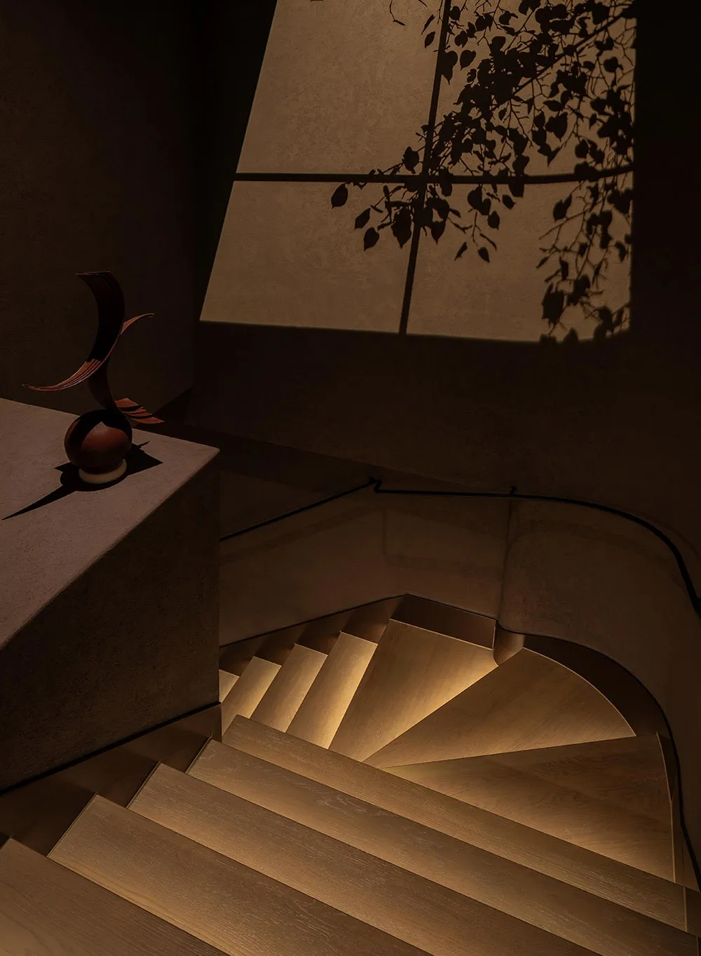 A warm and inviting interior space with a wooden staircase, suggesting a cozy and welcoming atmosphere