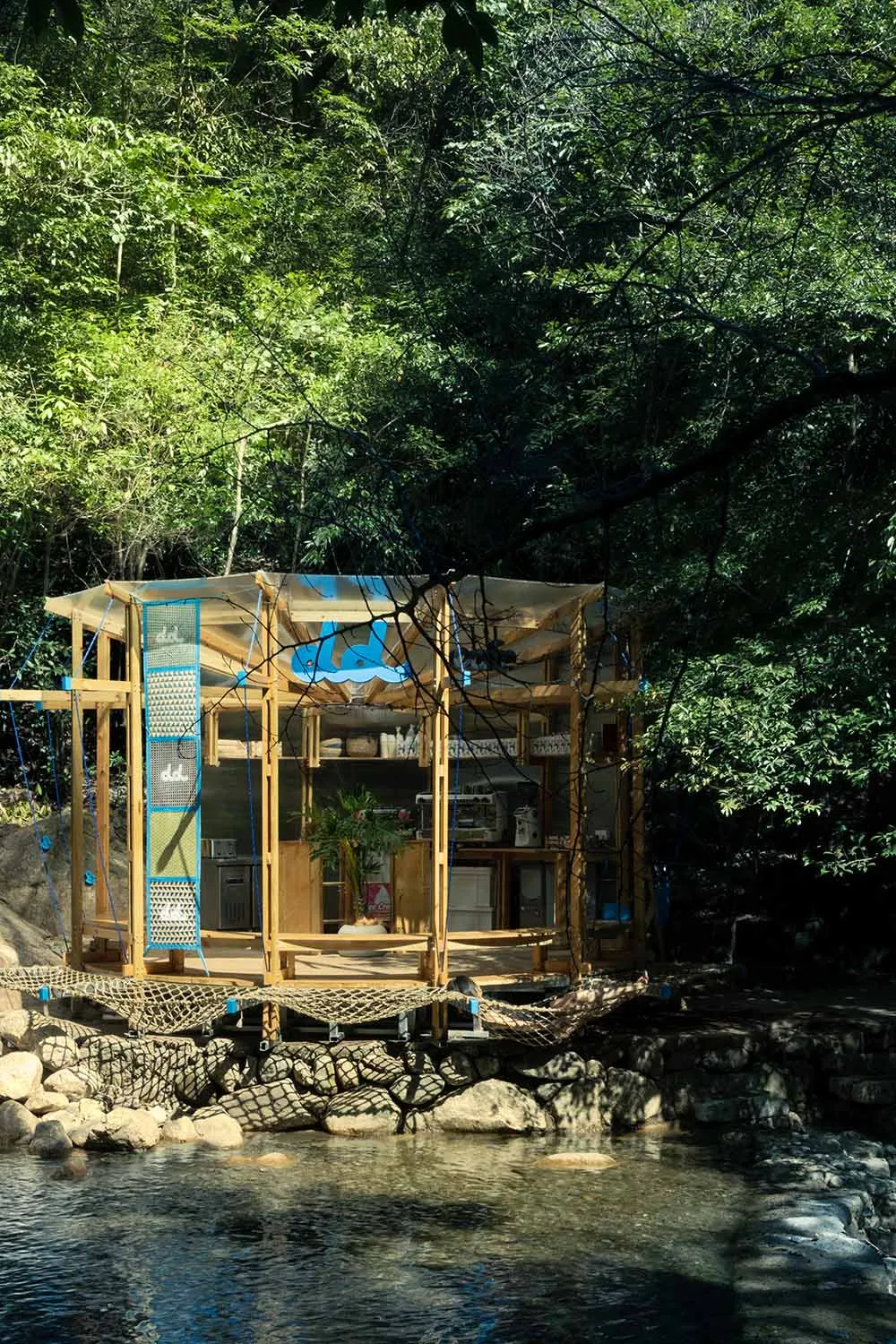 A serene and peaceful open-air wooden structure in a forest setting, designed for relaxation and leisure