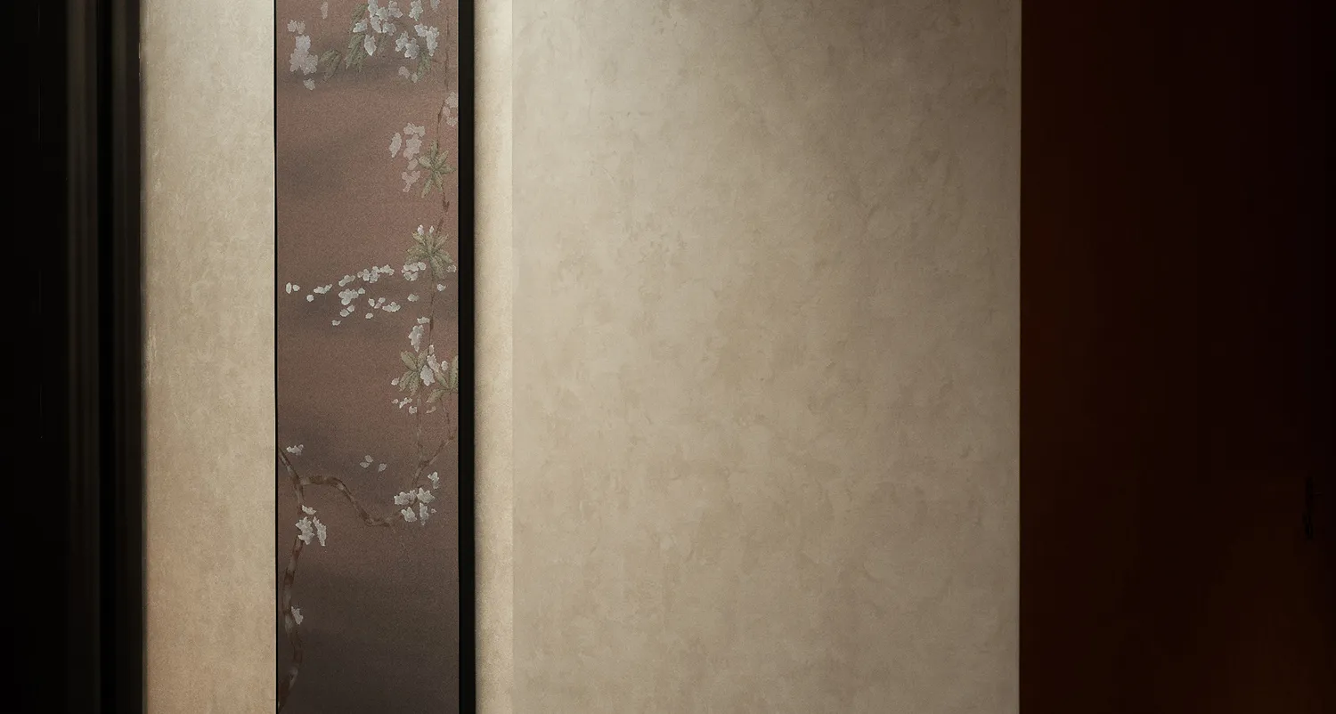 A traditional painting of cherry blossoms on a beige background, created with canvas and paint, evoking a serene and elegant atmosphere