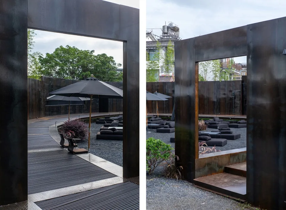 A well-designed outdoor patio with seating areas, umbrellas, and potted plants, creating a comfortable and inviting space for socializing and relaxation