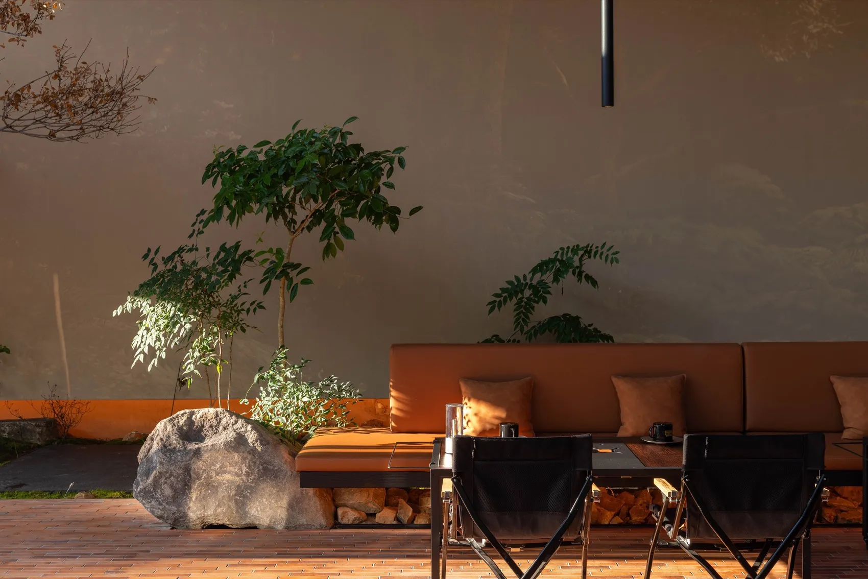 Modern living space with two couches, a dining table, chairs, and potted plants, featuring wooden elements and a neutral color scheme
