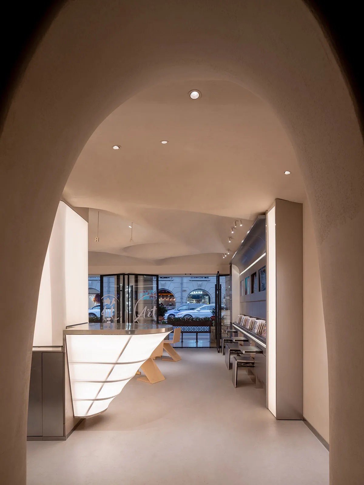 Spacious interior space with white walls, chairs, and dining tables, inviting atmosphere