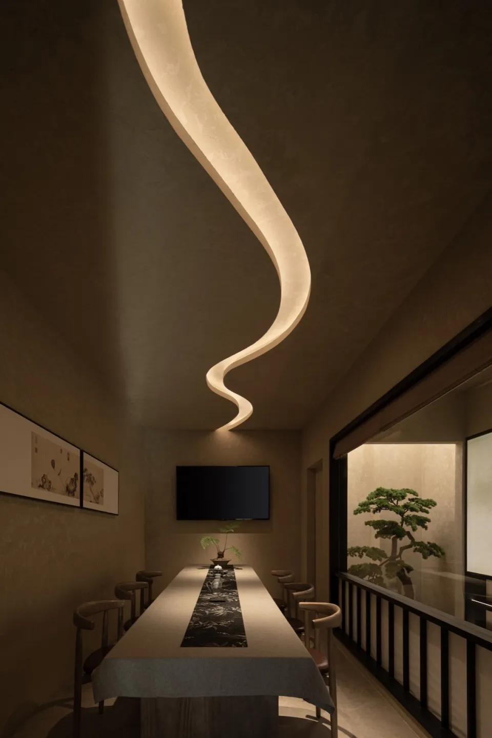 Dining area with a modern table and chairs, a mounted TV, and an elegant atmosphere