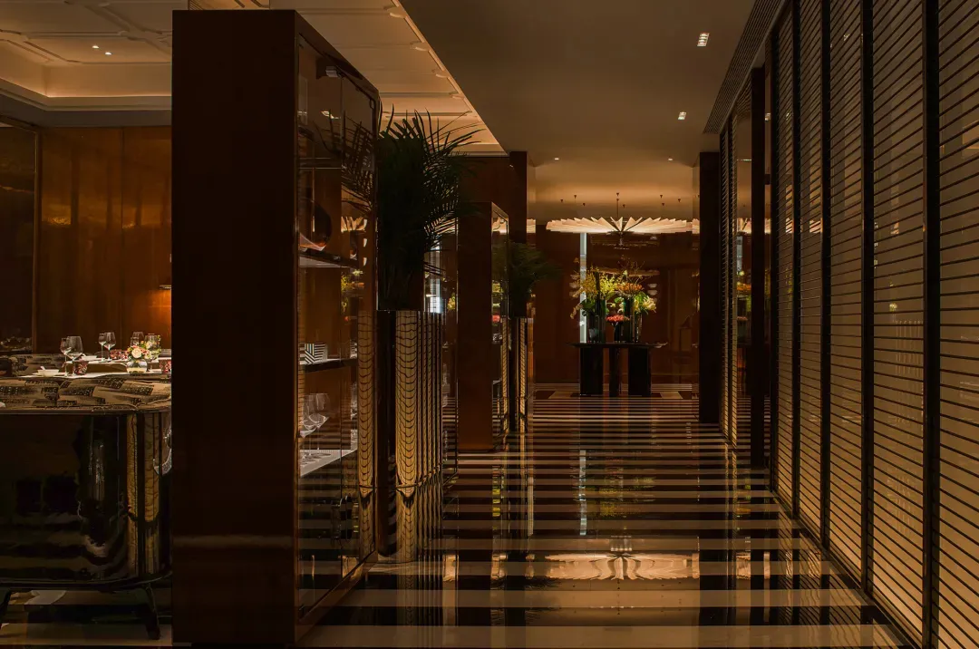 Sophisticated dining space with black and white checkered flooring, clean lines, and classic design elements