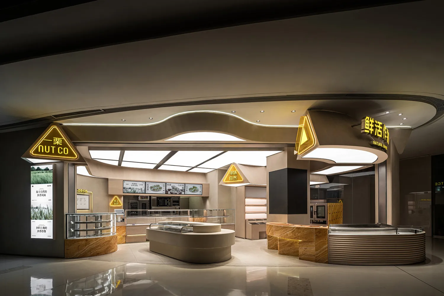 Spacious restaurant interior with modern furniture, sleek surfaces, and a well-lit dining area
