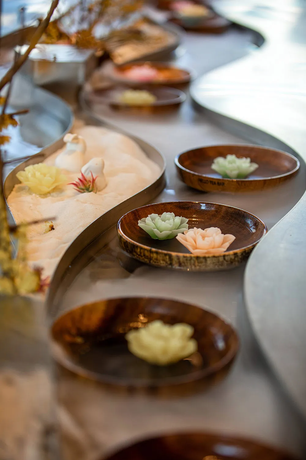 A table display of various bowls containing different types of food, arranged to create an inviting and appetizing atmosphere