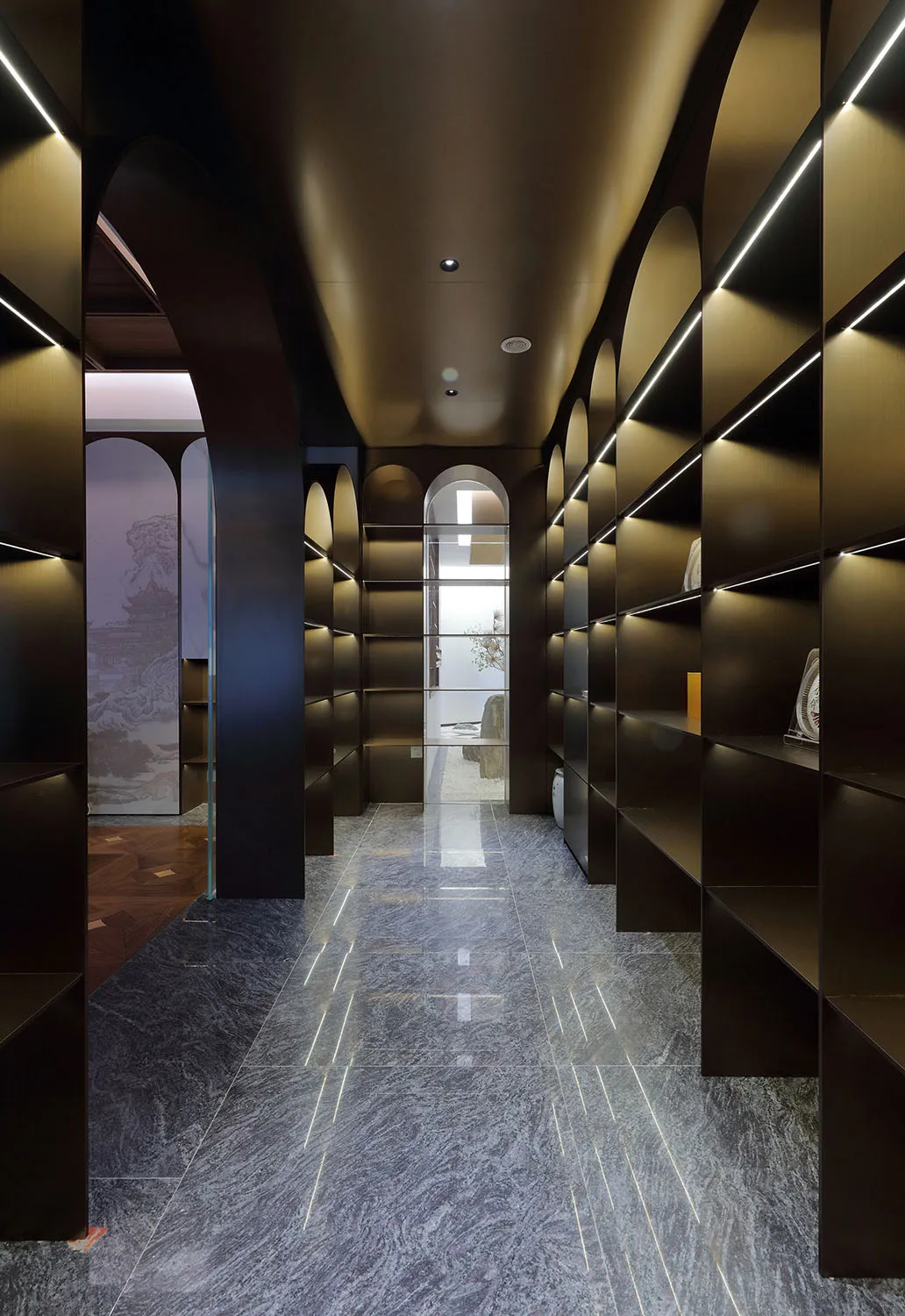 A well-lit library with wooden bookshelves, neatly arranged books, and a warm inviting atmosphere