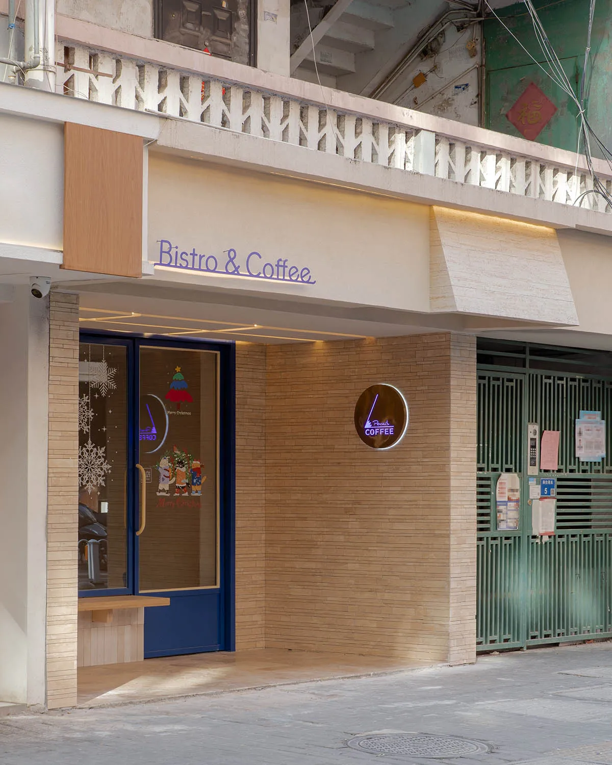Exterior of a coffee shop with a wooden facade, featuring a bench and a welcoming atmosphere