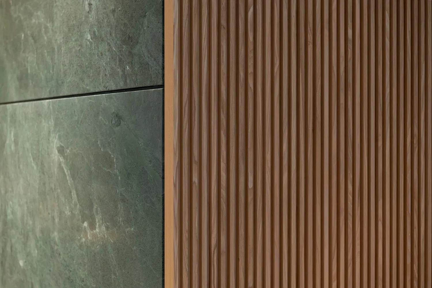 A modern interior space with a wooden wall featuring brown wood panel design, creating a sense of depth and visual interest