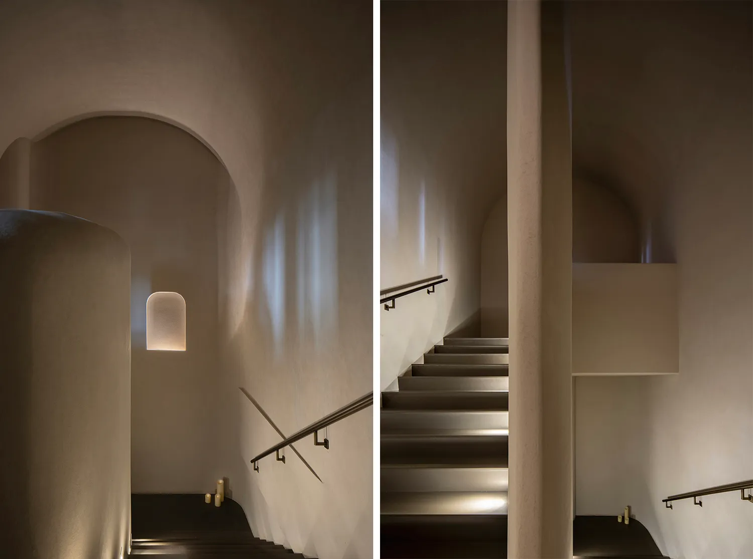 A stone wall with a black and white photo of a staircase on one side and a rendered architectural scene of the same staircase on the other, featuring a metal railing