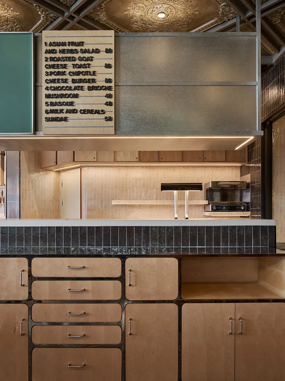 Kitchen with wooden cabinets, countertops, and appliances, featuring a casual and inviting atmosphere with a focus on food preparation and storage