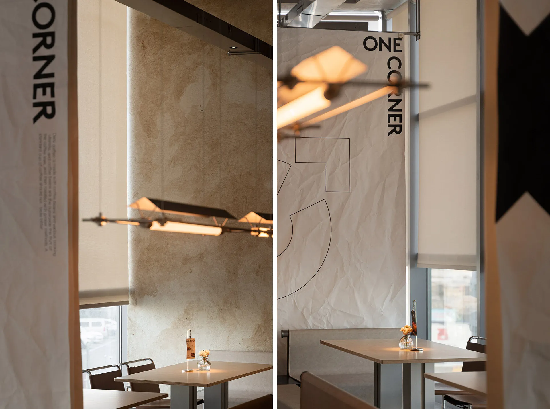 Dimly lit modern restaurant space with a dining area and kitchen featuring wood and glass materials