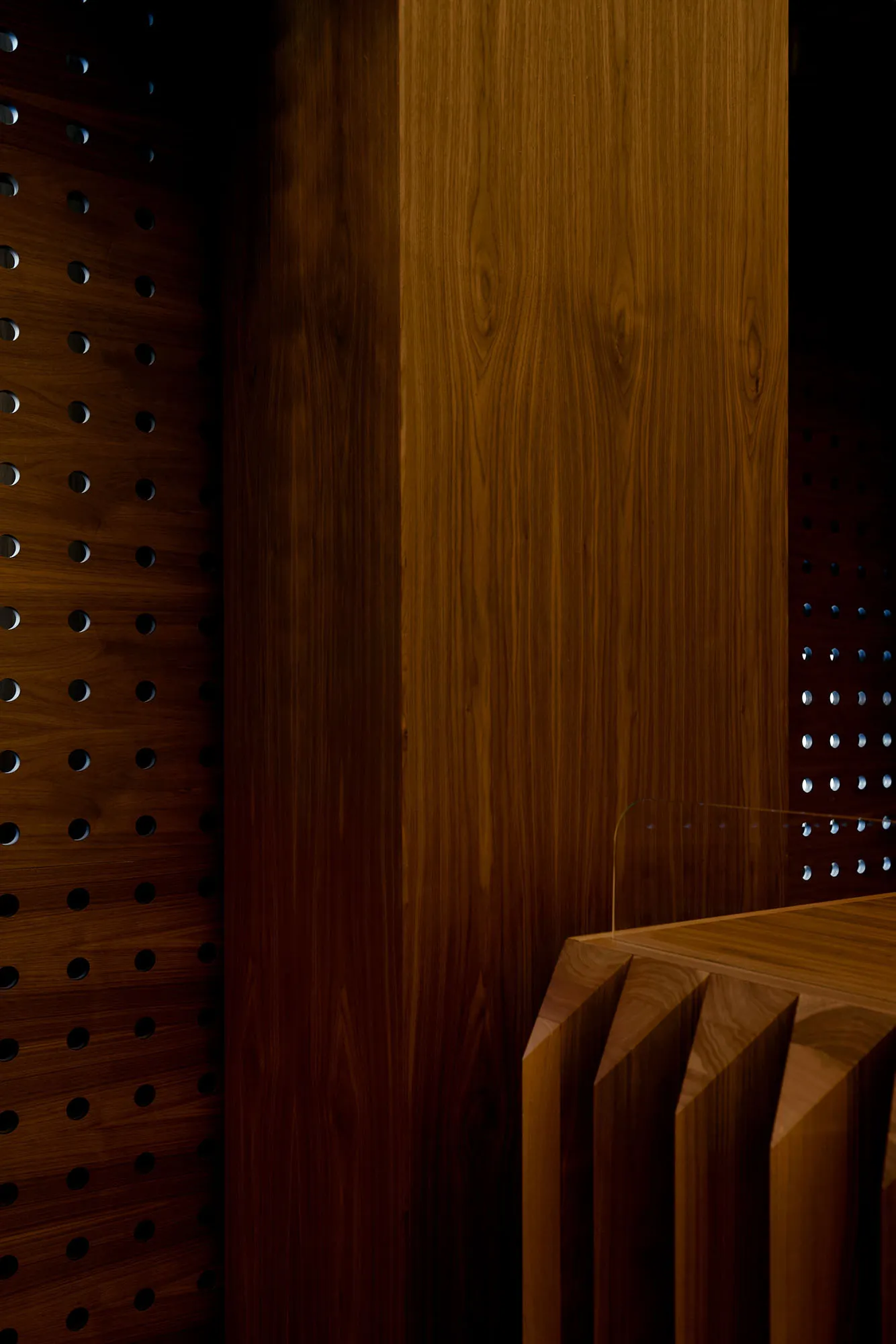 Warm and inviting interior space with wooden walls and floors, featuring two wooden benches