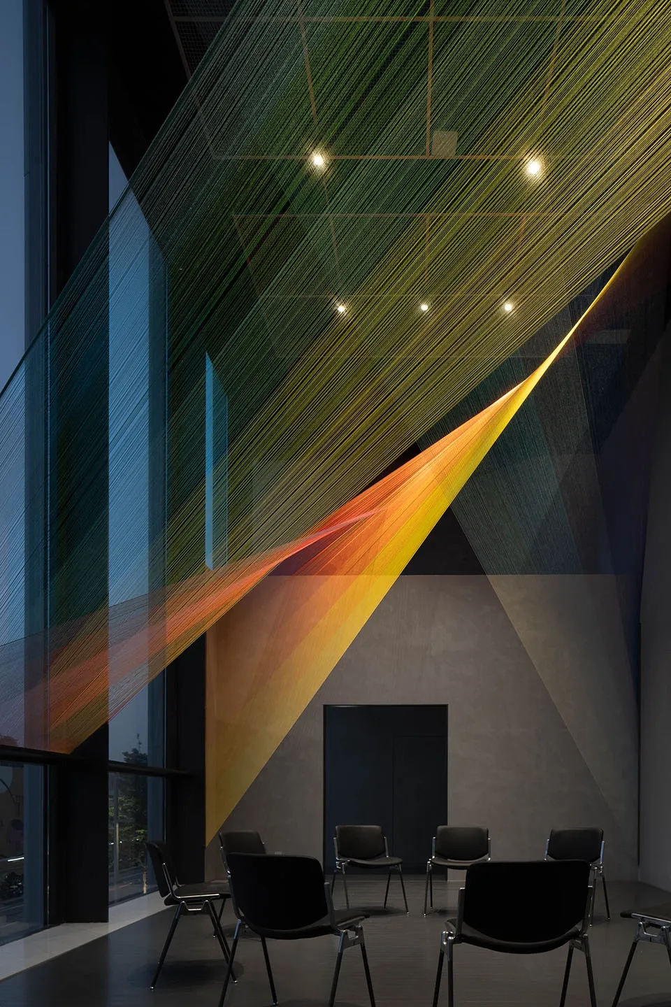 Office space with natural light, chairs, and a bright atmosphere