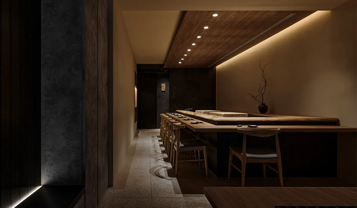 Empty restaurant interior with wooden floors and walls, dim lighting, and cozy atmosphere