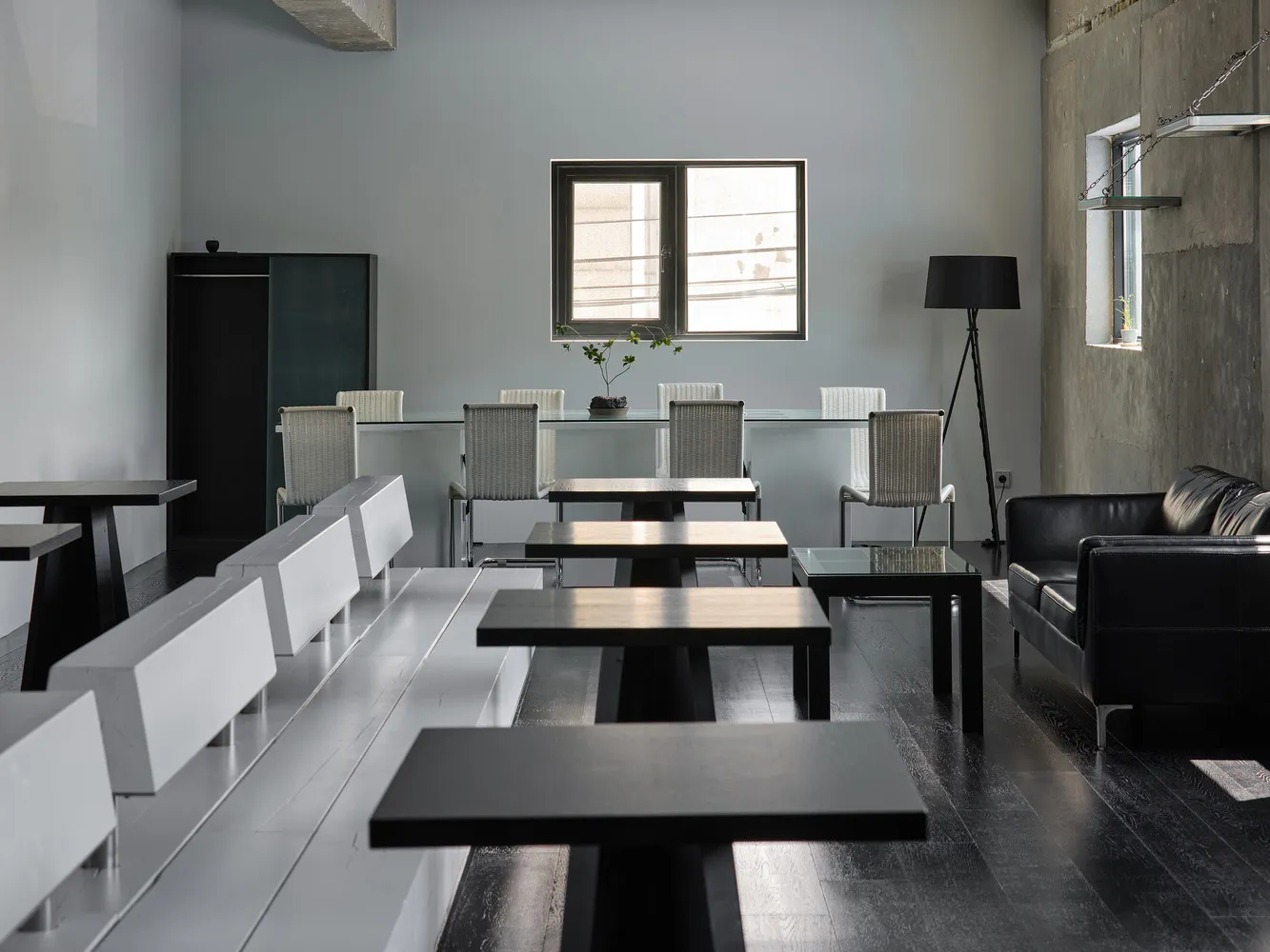 An empty restaurant with multiple tables and chairs, clean and inviting atmosphere, ready for customers