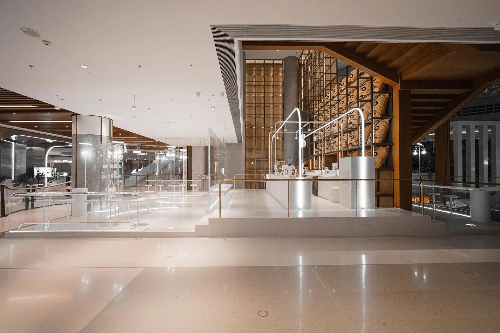 Large open space with high ceiling, featuring various statues and art pieces in an elegant and sophisticated atmosphere