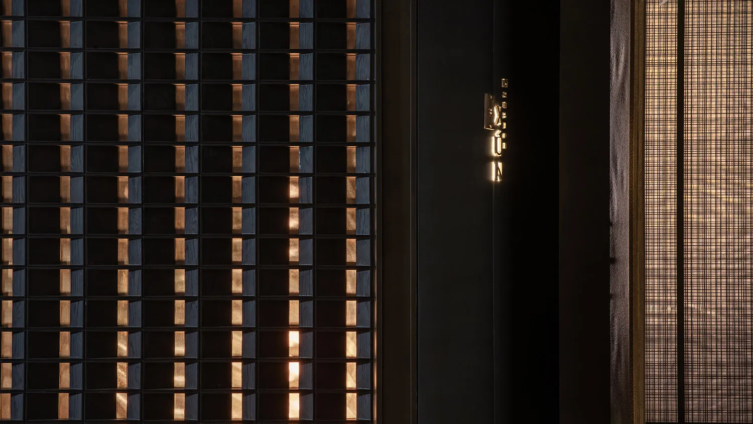 A dimly lit room with two doorways, one on the left and one on the right, creating a sense of mystery