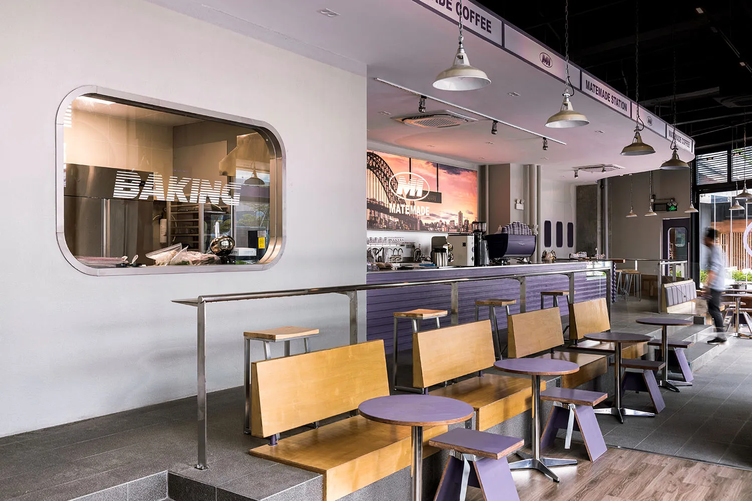 Inviting coffee shop interior with a counter and chairs, surrounded by cups and a warm atmosphere