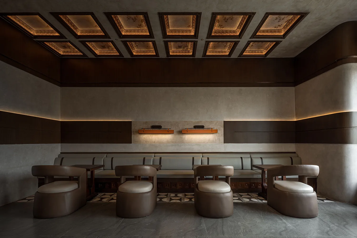 Comfortable seating area with multiple chairs and couches, well-lit with natural and artificial light, creating a relaxed atmosphere for socializing