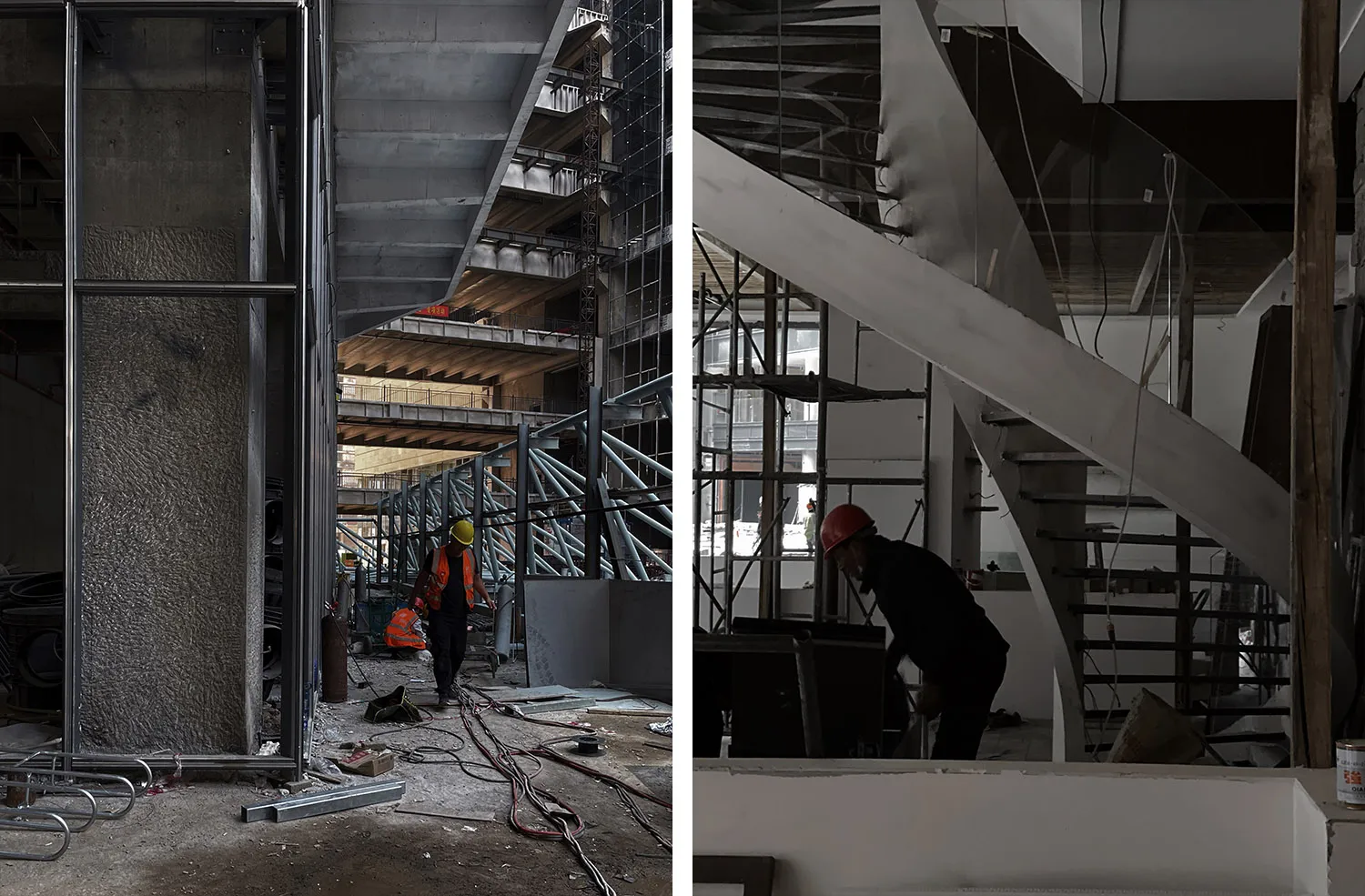 Construction workers on the ground level of an underground building, with a staircase leading down to multiple levels