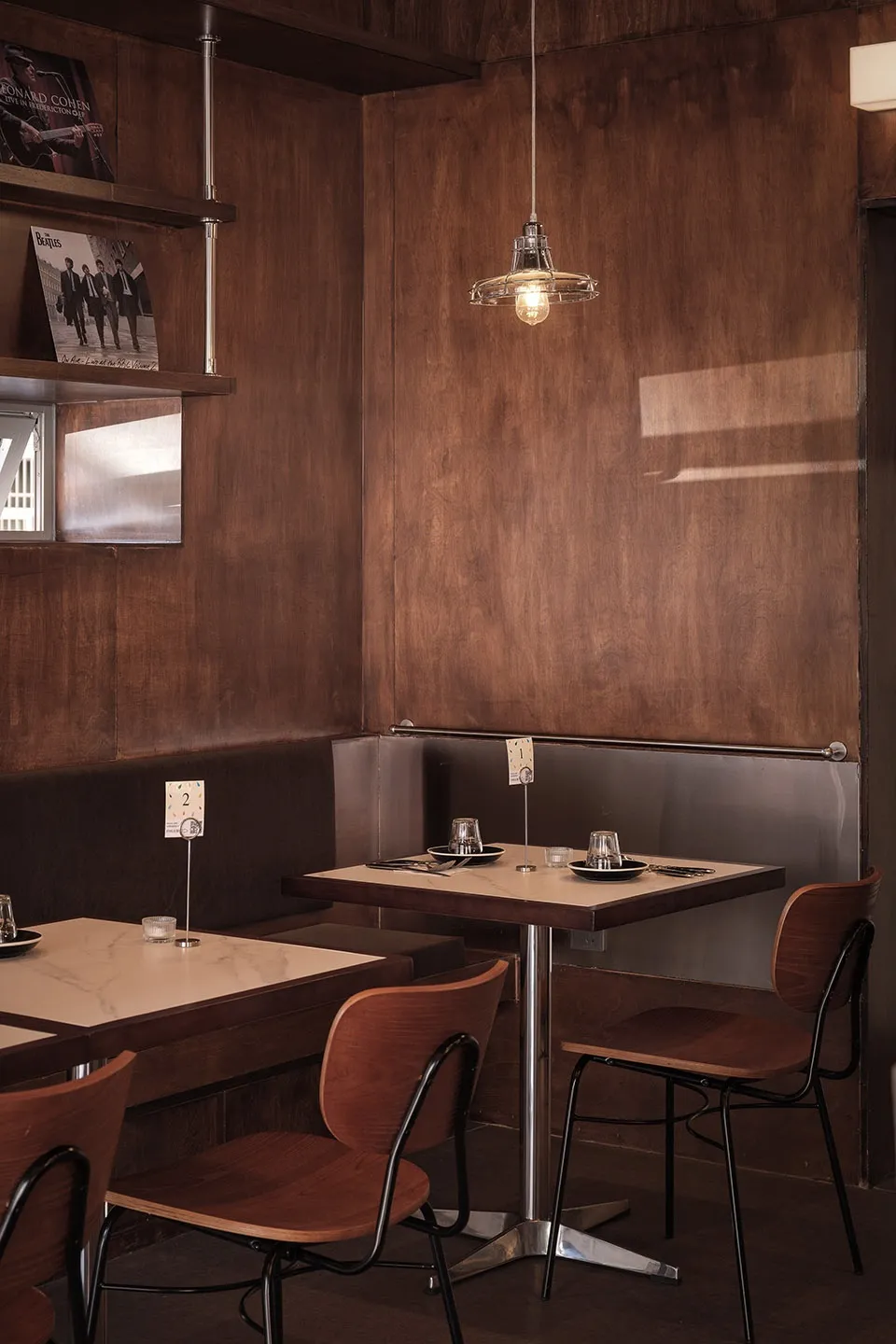 Warm and inviting dining area with wooden tables and chairs, suitable for larger groups or events