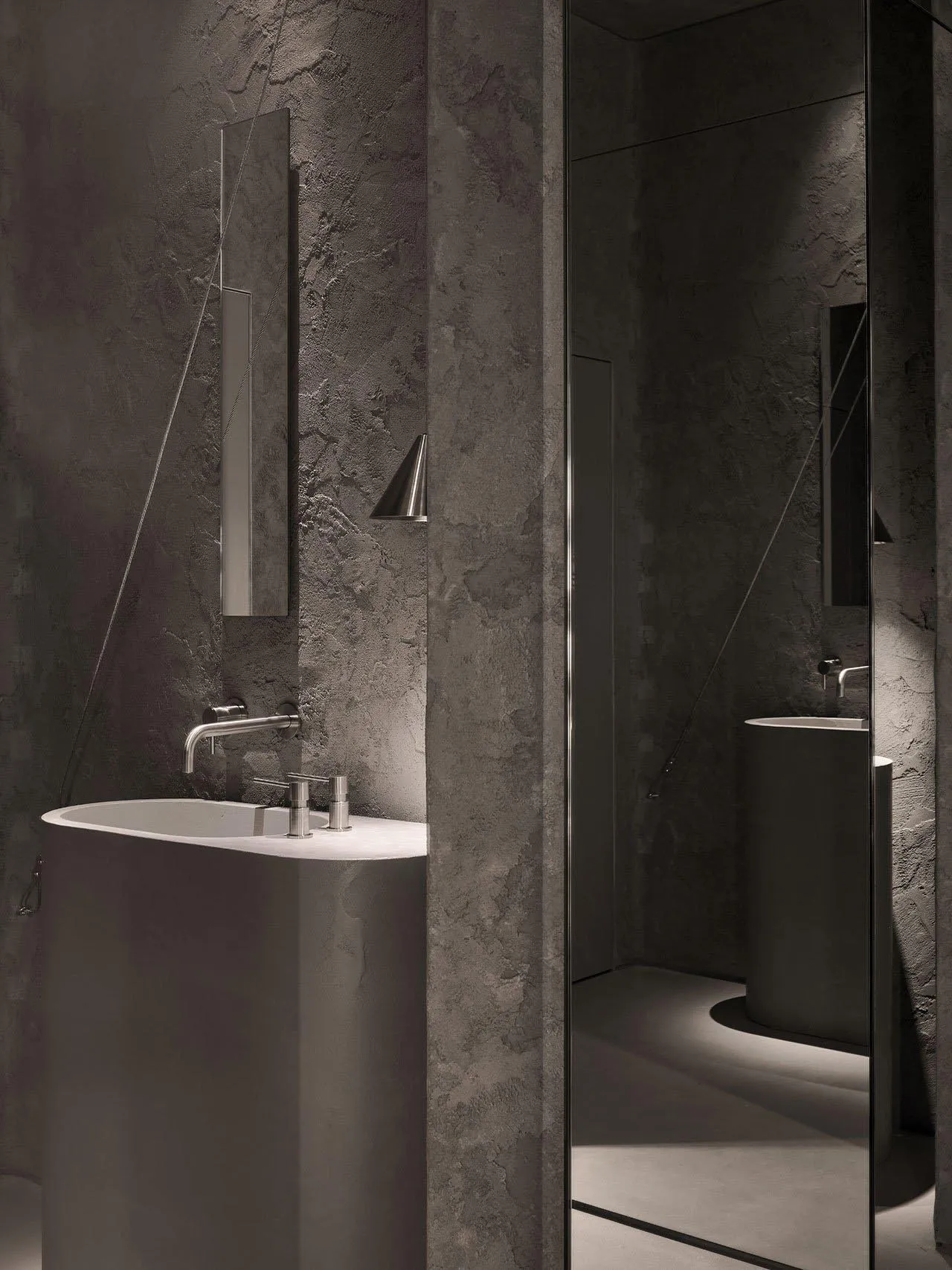 Modern bathroom with a metal bathtub and a minimalist sink, featuring a clean and sophisticated atmosphere with a focus on functionality and contemporary design