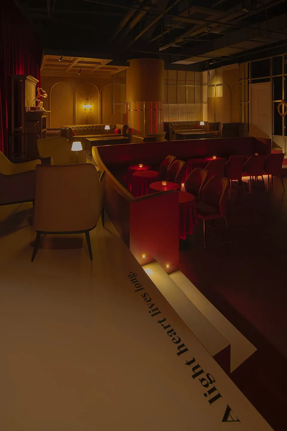 Inviting restaurant interior with red walls, white tables, and comfortable seating areas