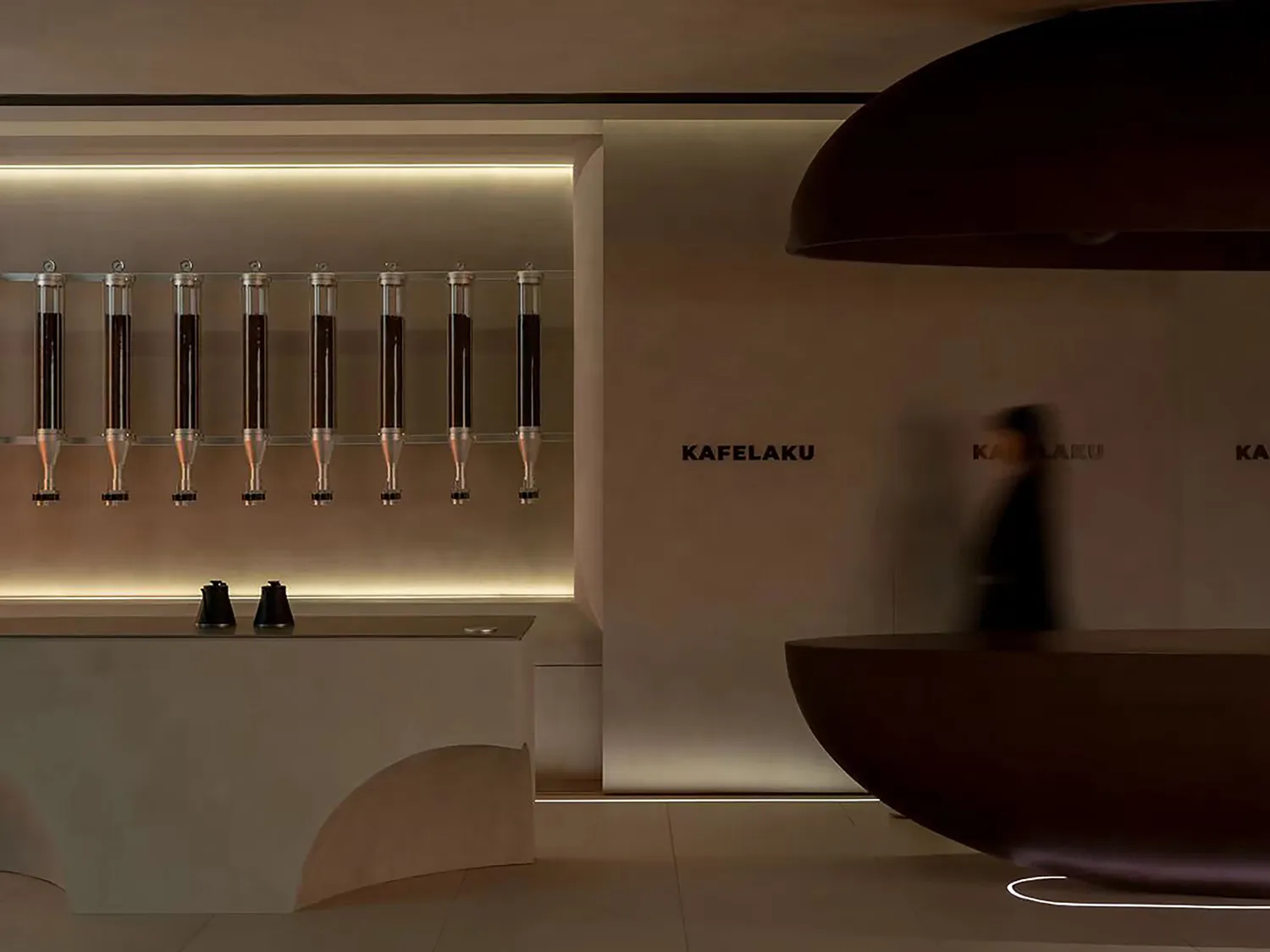 A modern interior design showroom featuring a wall display of multiple bottles in various positions, creating a visually appealing and organized presentation