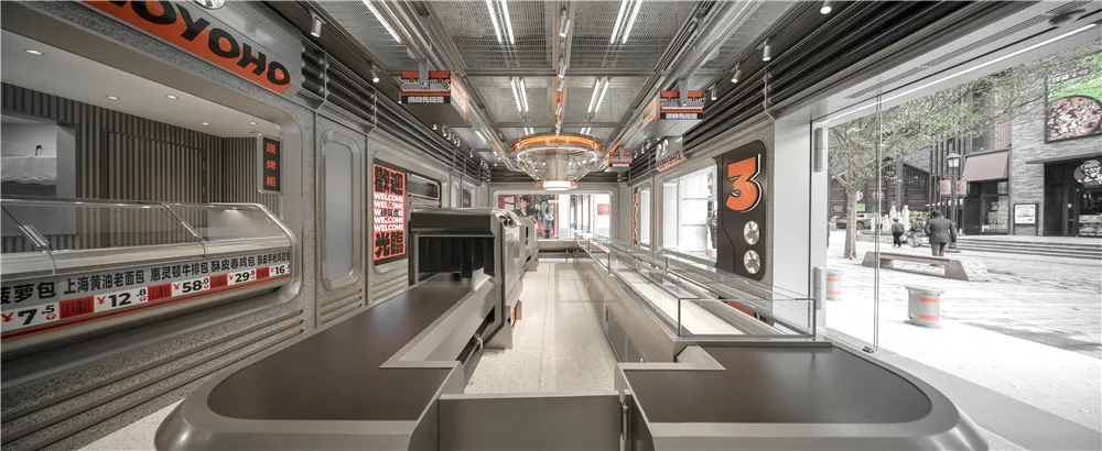 A large open lobby with tables, chairs, and benches, creating a spacious and inviting atmosphere