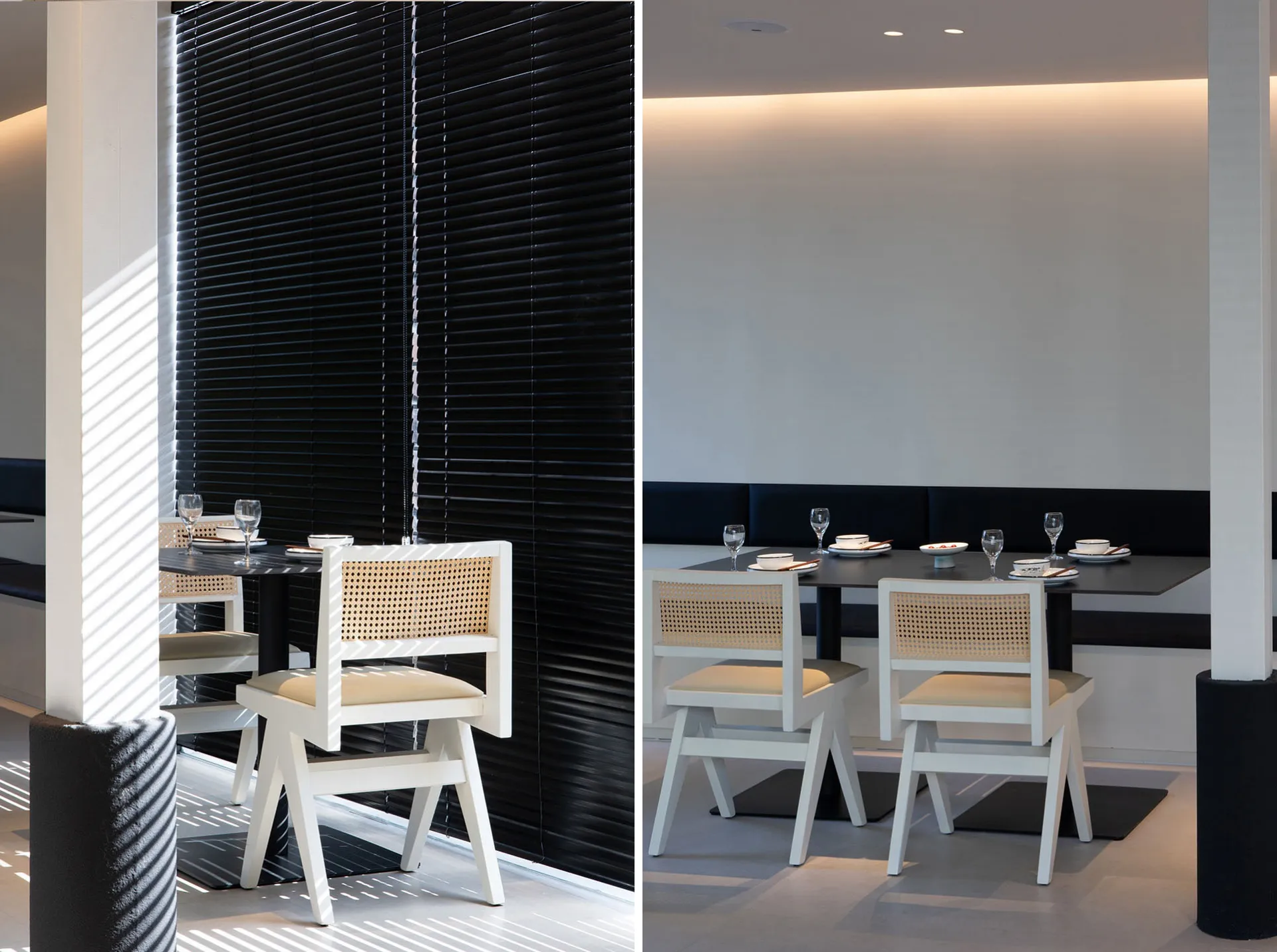 Elegant dining area with white and black chairs, wine glasses, and cups, set up for dinner service