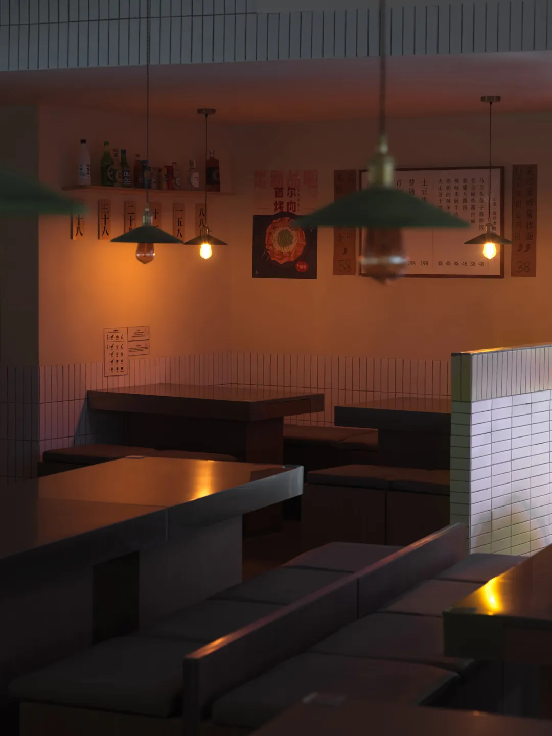 Inviting restaurant interior with dining tables, chairs, and bottles, featuring a comfortable atmosphere and pleasant dining experience