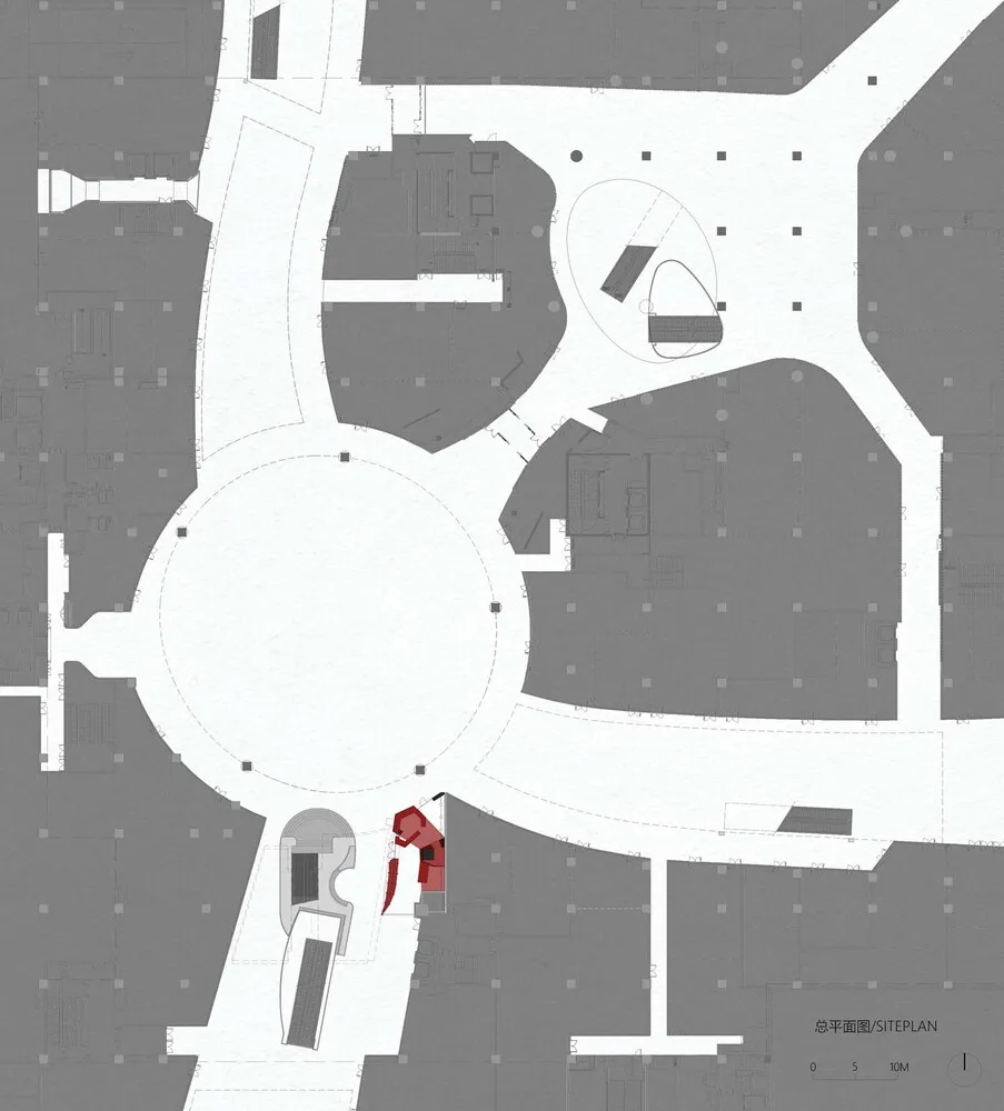 現代建築的建築圖，具圓形中央區域，周圍環繞房間，包括餐廳區和廚房，紅色物件標示焦點