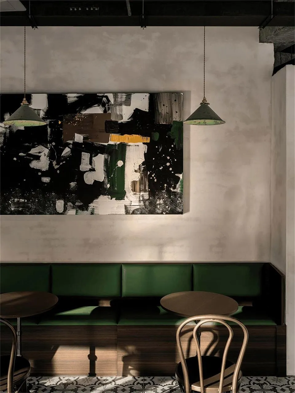 Inviting restaurant interior with green benches and tables, creating a comfortable dining experience