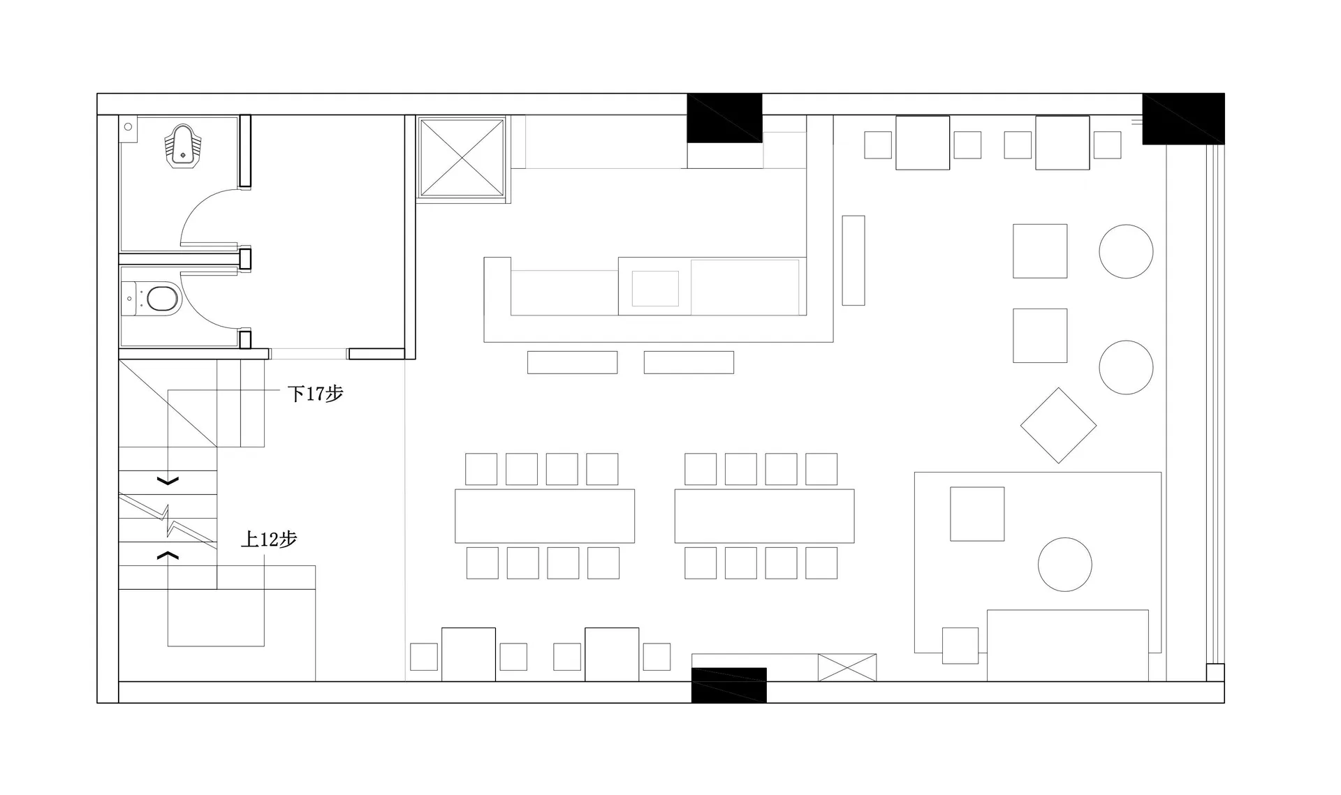 A calm and inviting commercial space with a large dining table and chairs, set up for customers