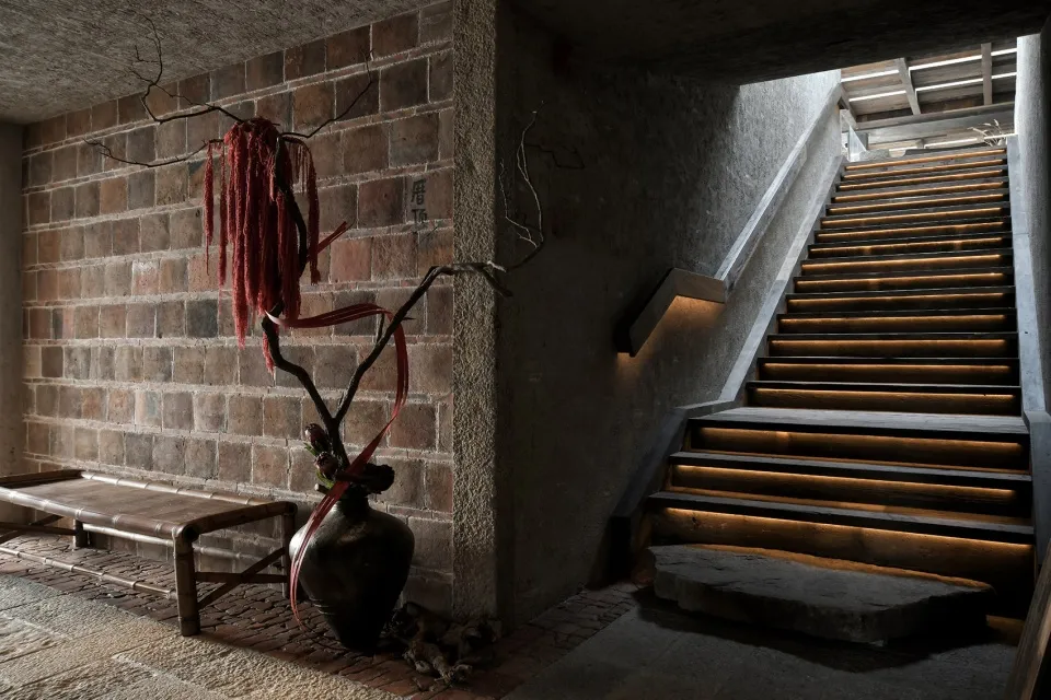 A multi-level staircase with stone steps and a sense of depth and complexity within the structure