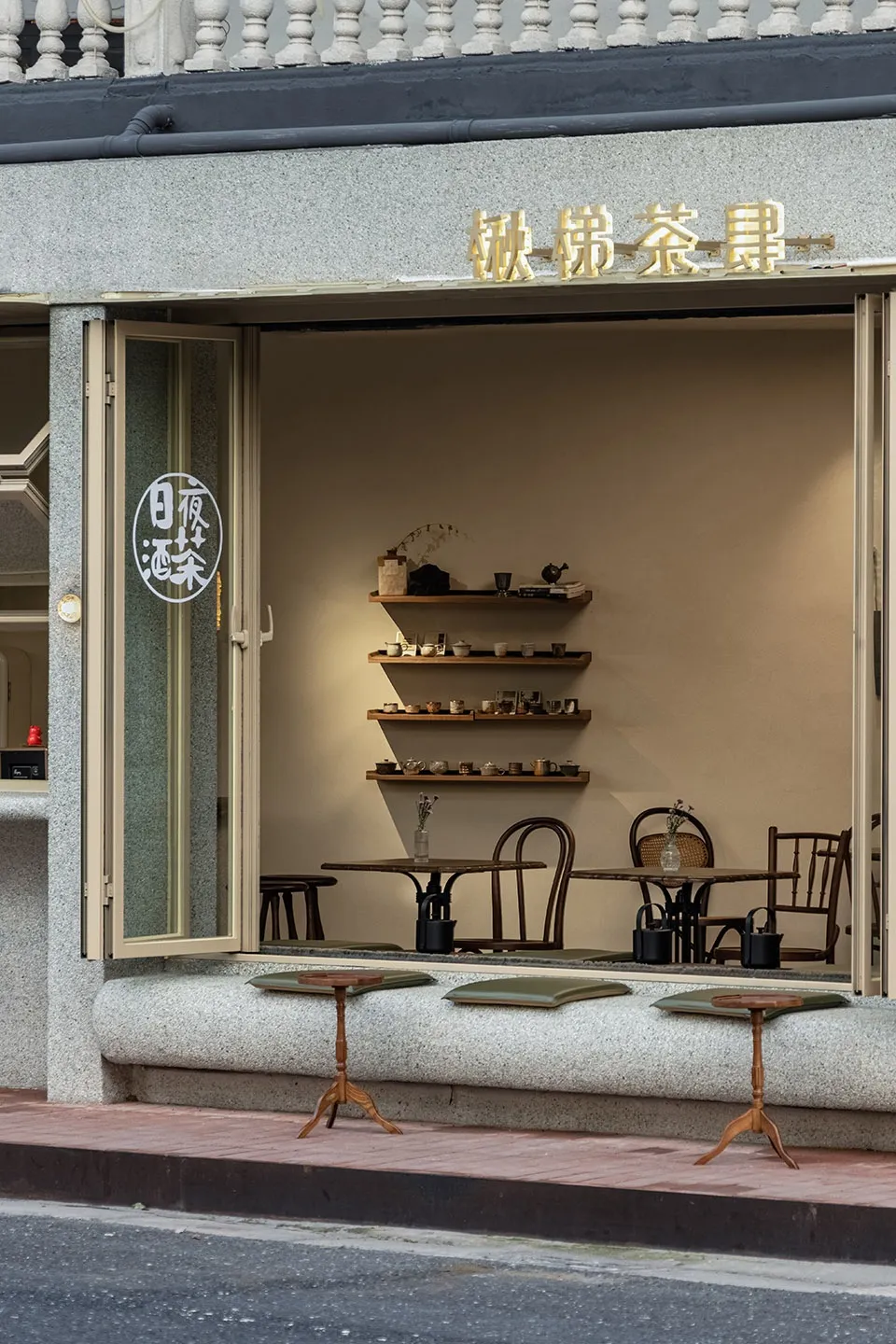 A modern Asian restaurant with a dining area, chairs, cups, and decorative elements, creating an inviting and comfortable atmosphere