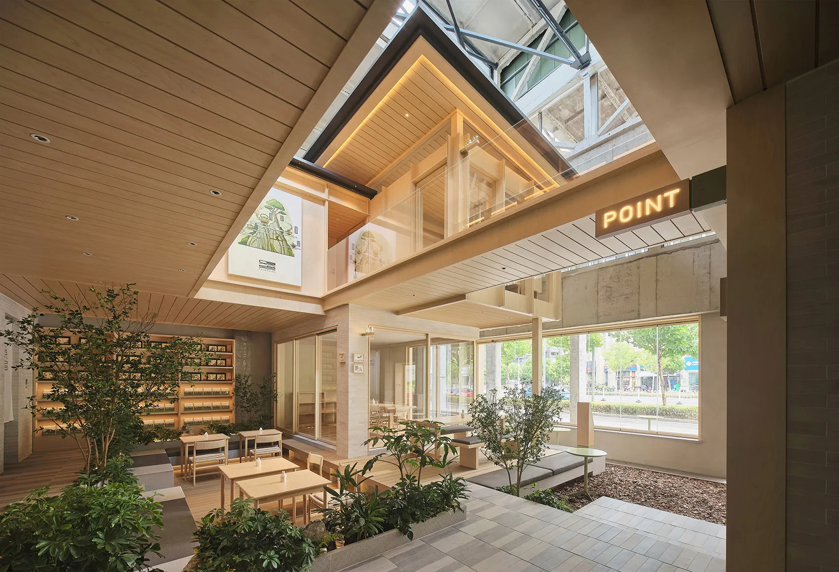 Modern cafe with wooden elements, glass walls, and dining tables, creating a comfortable atmosphere for guests
