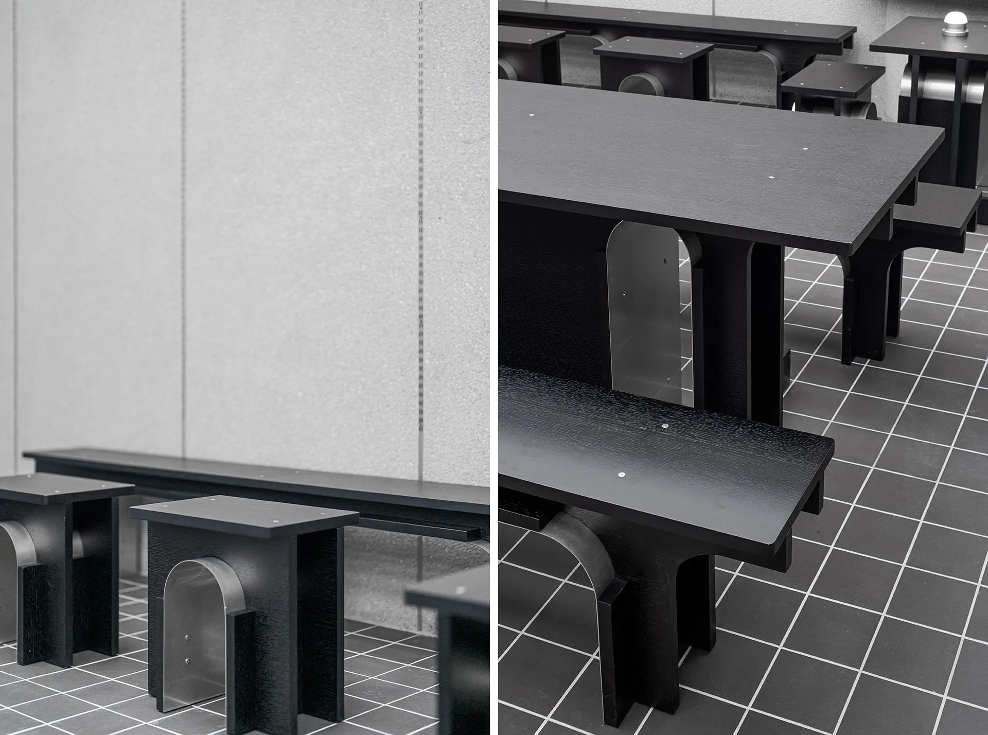 Industrial dining space with a metal table and wooden chairs, surrounded by a concrete wall and natural light