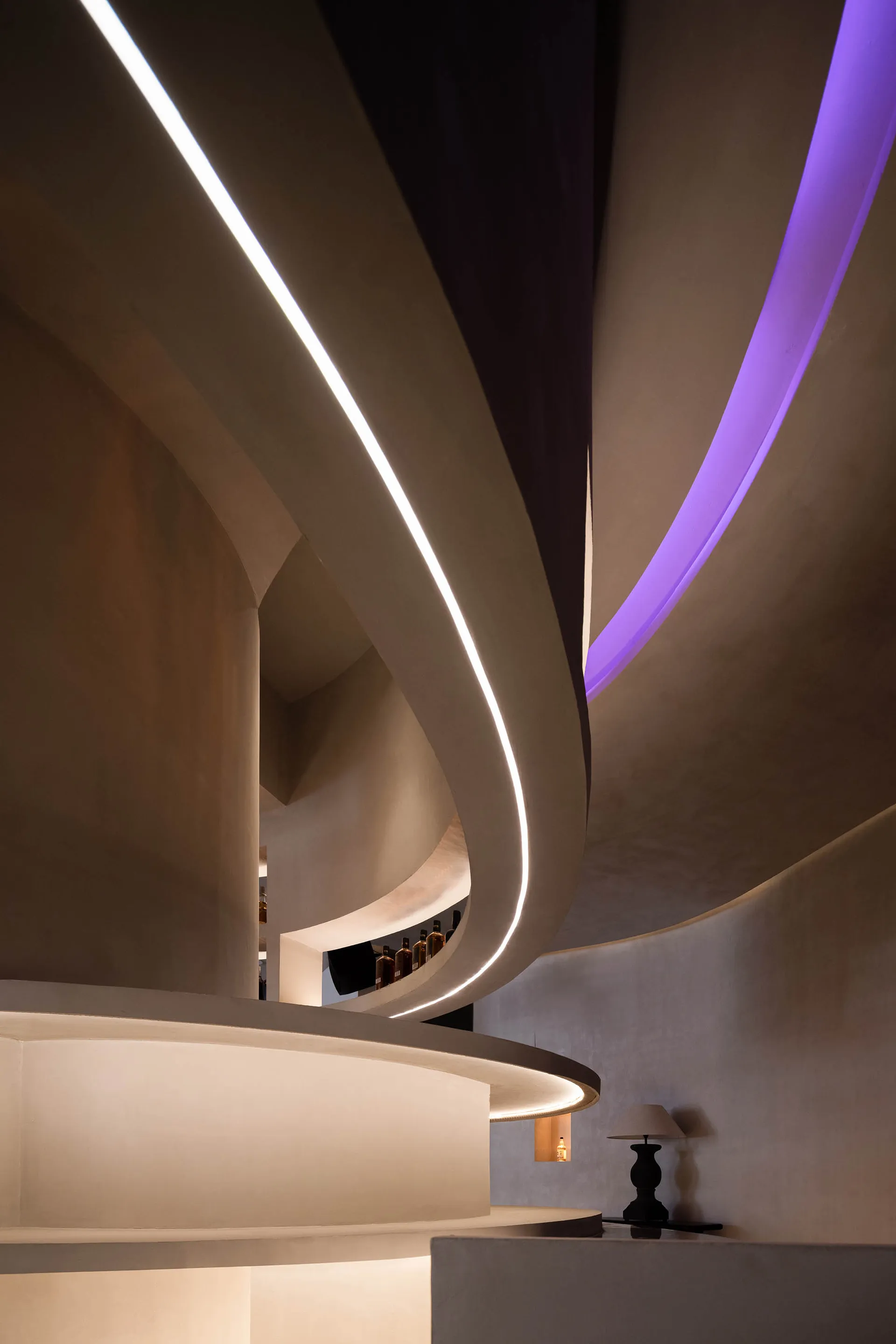 A rendered image of a spiral staircase in a tunnel-like space with curved walls and no visible materials or lighting