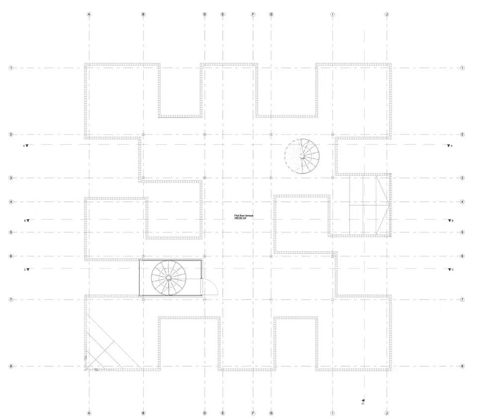 2D floor plan of a residential building with various rooms, including a living area, dining area, and bedroom, featuring chairs and a wheel, with linework, labels, and measurements
