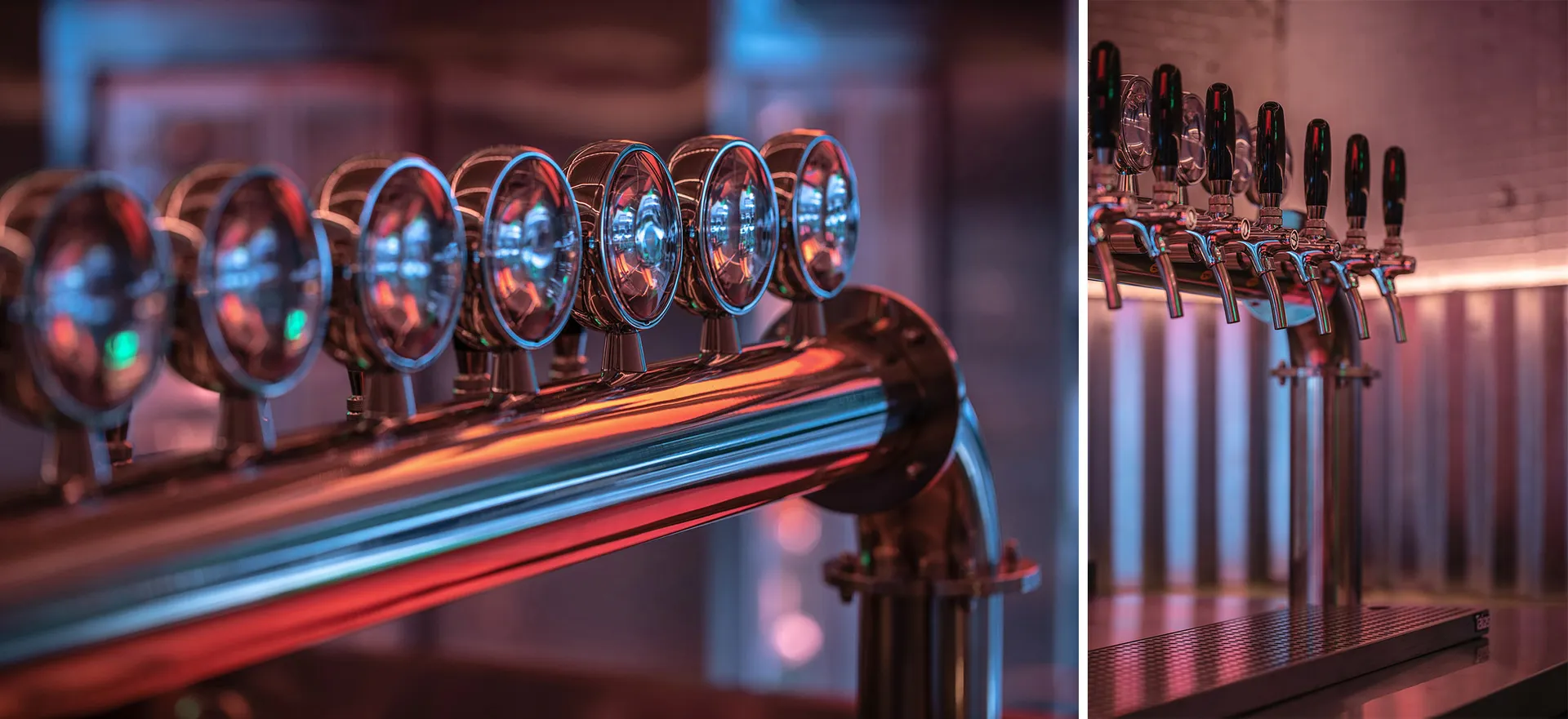 A modern bar with stainless steel elements, featuring beer taps and bottles on a wall