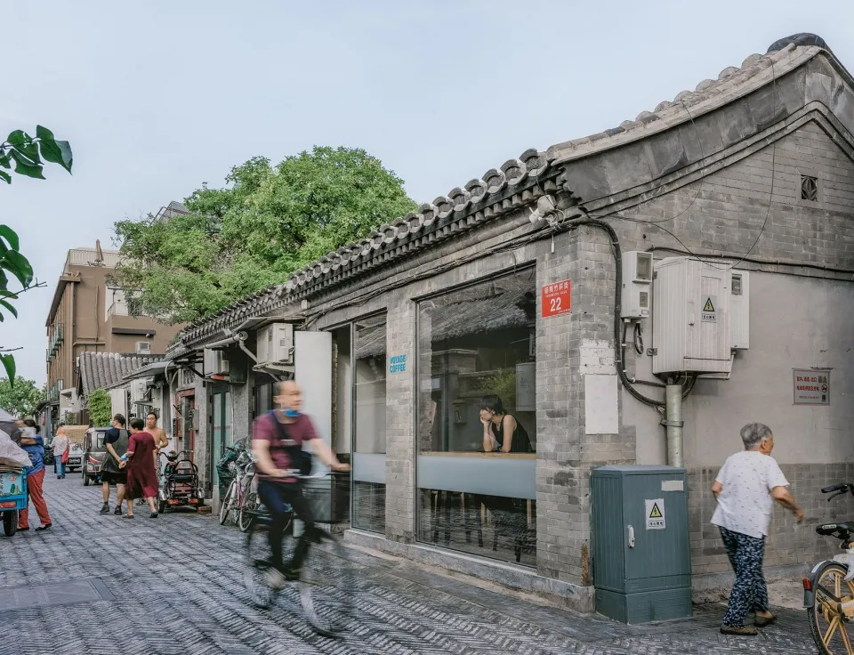 A restaurant with a blend of stone and wood elements, featuring a mix of traditional and modern styles, with a cozy ambiance and warm atmosphere