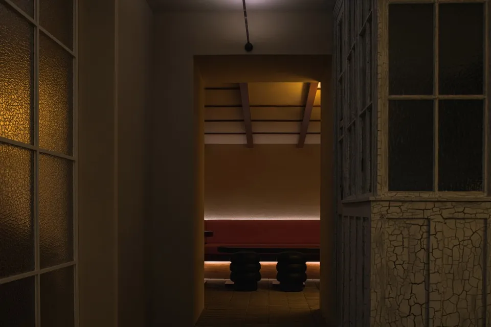 Cozy room with a red bench and three chairs, surrounded by white walls and dim lighting