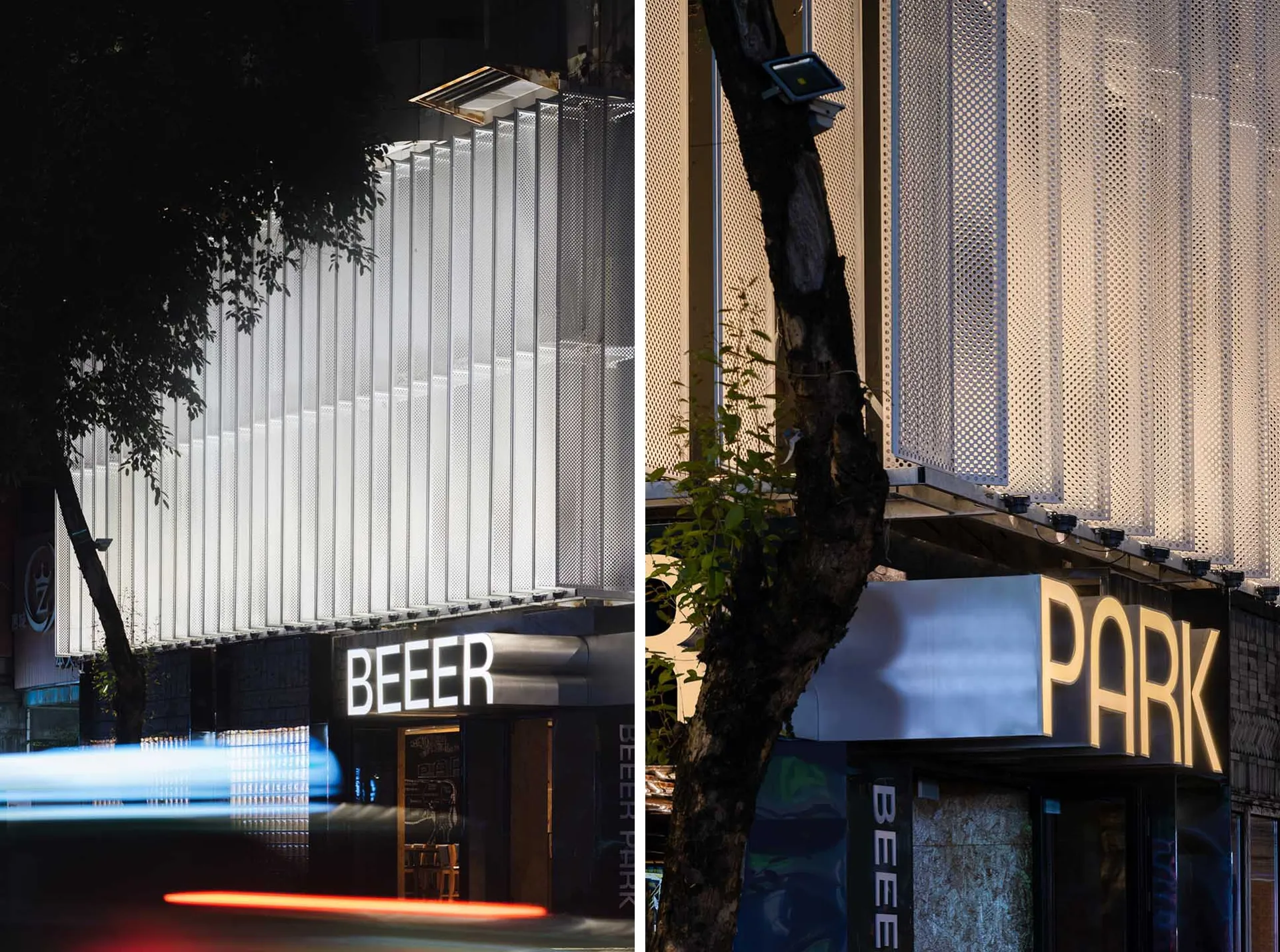 A modern building with a large glass wall and trees in the background, set against a blurred urban environment