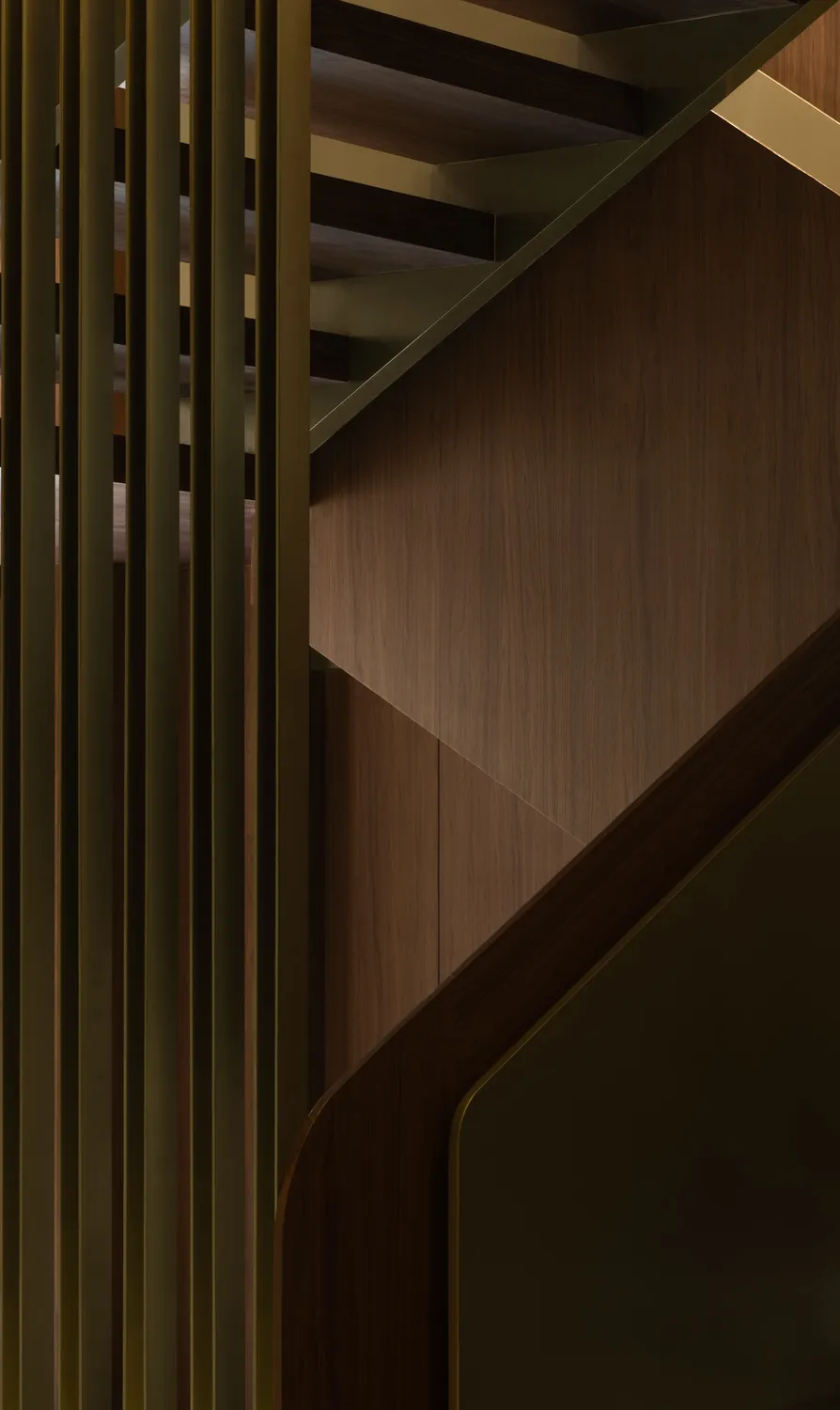 A darkened space with a wooden staircase, giving a sense of warmth and character